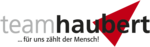 Logo von Team Haubert. Schriftzug in schwarz mit rotem Dreieck.