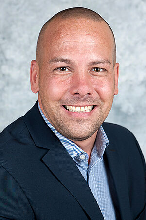 Porträt eines Mitarbeiters der Wiener Städtischen.