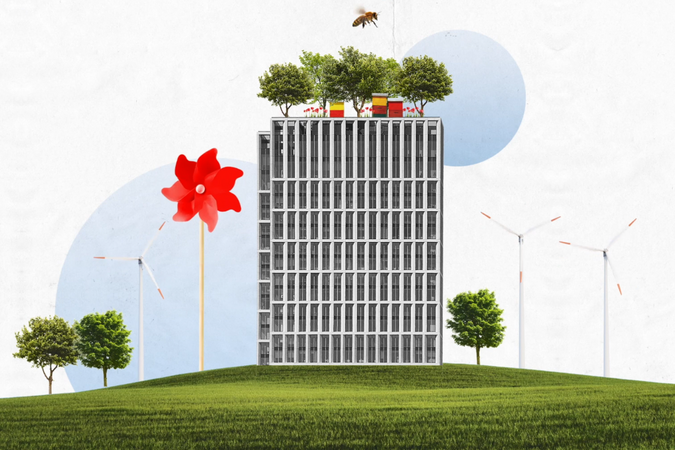 Ein von Blumen und und Bäumen umzingeltes Hochhaus.